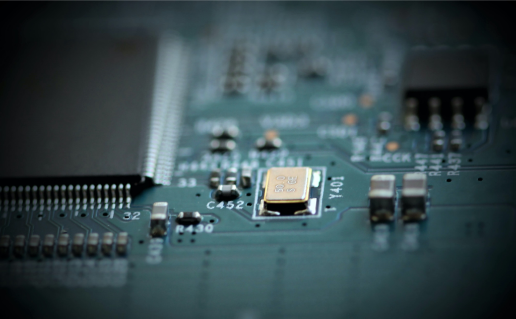A circuit board represents an automotive chip shortage.